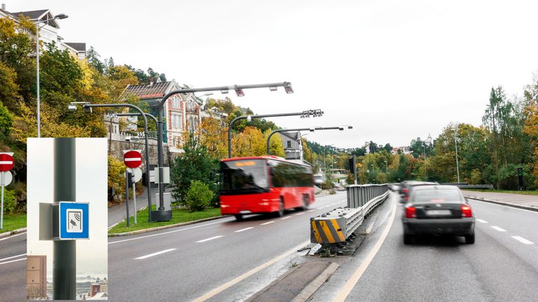 bus and car drving through a norwegian road toll station.